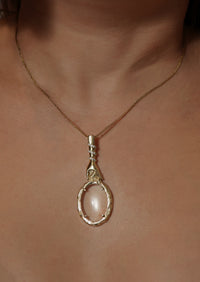 Care Magnifying Glass Pendant