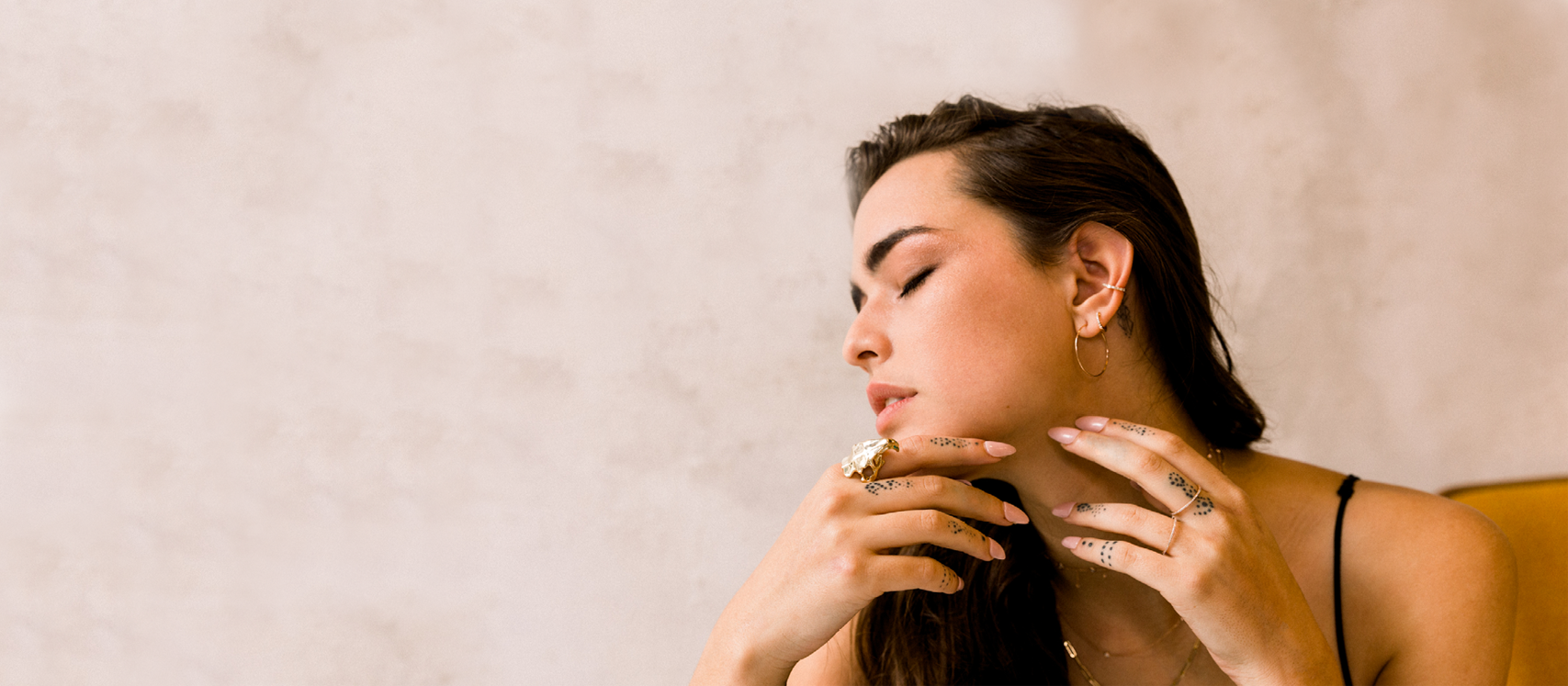 Gold and Diamond Hoop Earrings and Ear Cuff and Statement Ring on model Lucy Vives